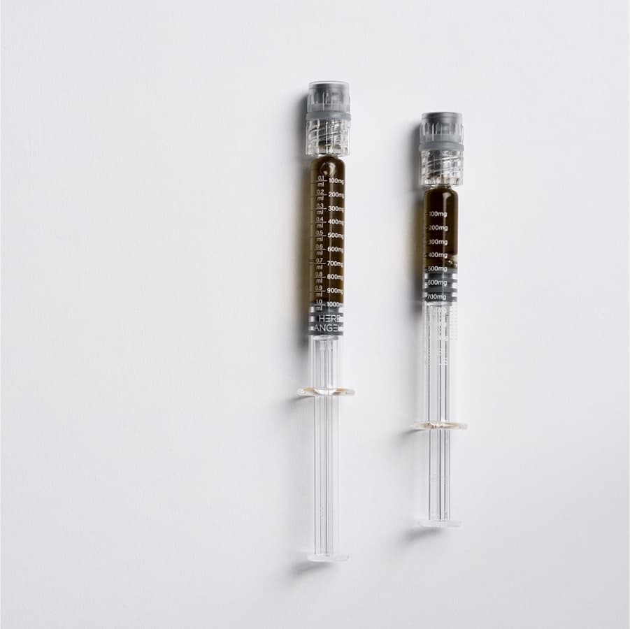 RSO syringes with measurement markings - Premium Rick Simpson Oil with visible cannabinoid potency